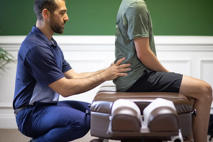 Dr. Jamie adjusting a patient