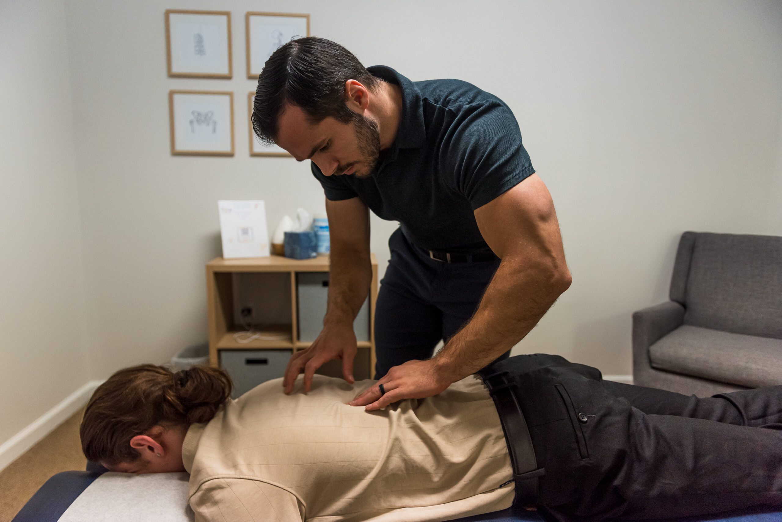 Chiropractor doing a spinal adjustment for patient